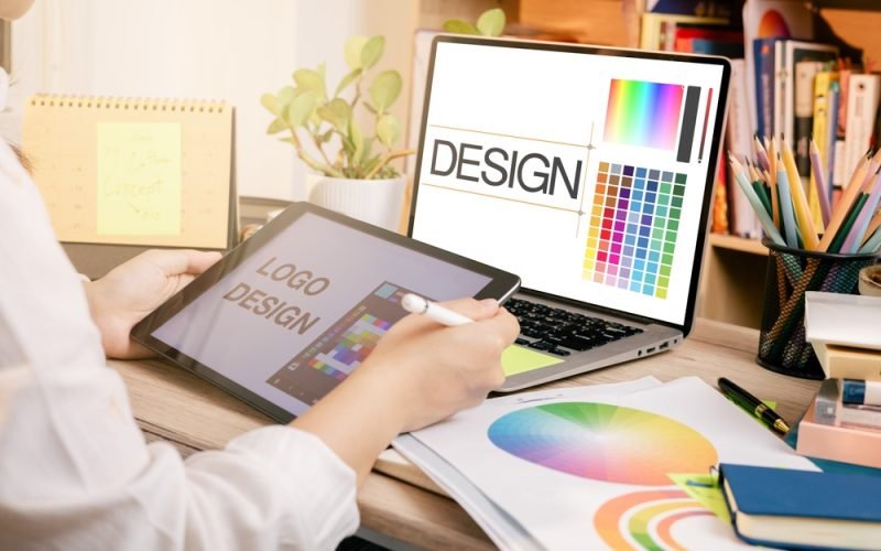 Designer,At,Work,On,A,Table,,Selecting,Color,Shades,For